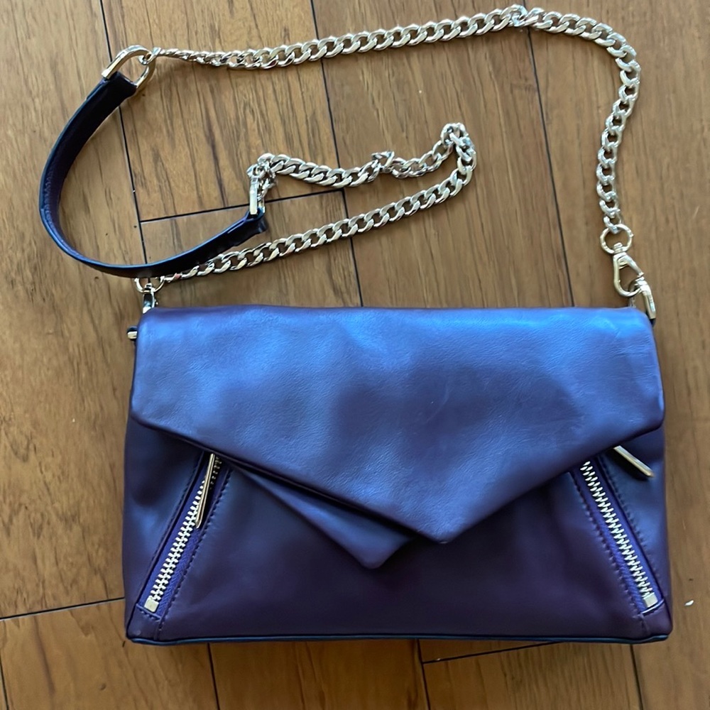 Pour La Victoire purse. Plum color. Leather. New condition.